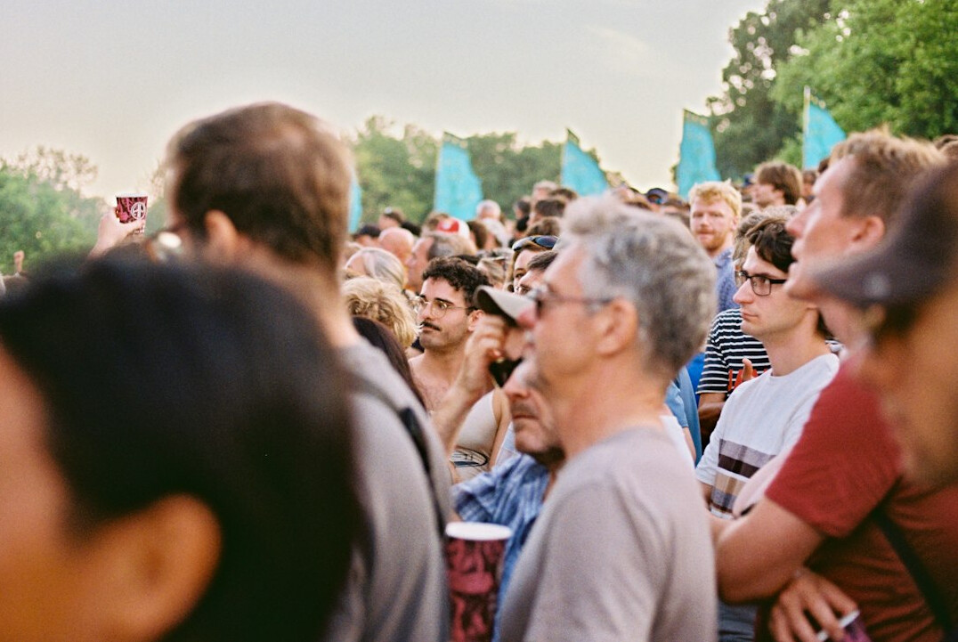 crowd of diverse people talking
